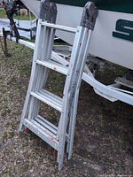 Ladder folded, front view showing rungs and hinge plates