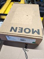 Closed Moen box showing brand