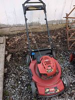 Full view of Toro Recycler 22 Personal Pace lawn mower on gravel surface