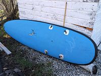 Blue hull with fin boxes and black rail trim