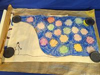 Crayon drawing with snowman and multicolored geometric shapes