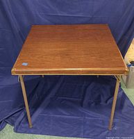 Top view of brown square table with legs extended