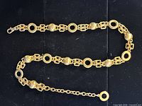 Gold-tone chain belt with circular and spherical links