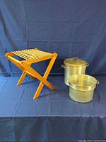 Full lot: wooden drying rack, aluminum pot with lid, perforated insert
