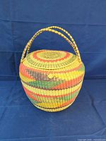 closed basket front view showing handle and striped weave