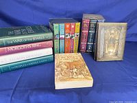 Group shot showing hardcover volumes, boxed paperback sets, The Tolkien Companion and a DVD case