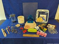 Overall lot layout showing all kitchenware and napkin rings