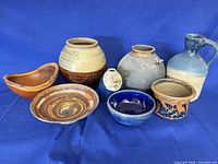 Group shot of all eight pieces showing size, shape and glaze variations