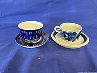 Both cup and saucer sets side by side showing patterns