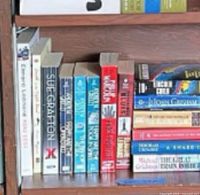 Left and centre close-up of upright paperbacks including Sue Grafton titles