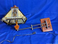 Full view of swing arm lamp with cord and mounting plate