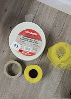 Top view of three fiberglass mesh tape rolls showing Grabber label and two smaller rolls