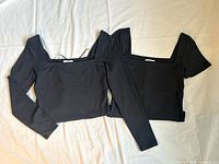 Both bodysuits front view side by side