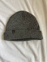 Full view of grey ribbed beanie