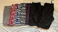 All seven folded pants and leggings lined up for overview