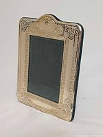 Oblique front view showing silver border and photo opening