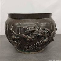 Front view showing bird and branch relief