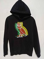 Front view of black hoodie with multicolour owl graphic