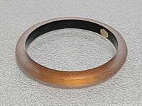 Full view of lucite bangle bracelet showing gradient color and matte texture