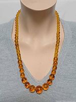 Necklace displayed on mannequin showing bead graduation