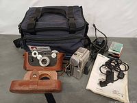 Lot overview showing both cameras, bag, accessories