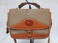 Front view showing flap, logo patch, trim, hardware, overall condition