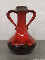 Front view of red and brown drip glaze double-handled vase