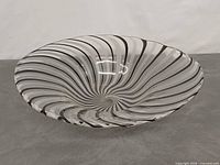 Side view showing flared profile and ribbon pattern