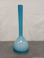 Full view of blue cased glass tulip vase front