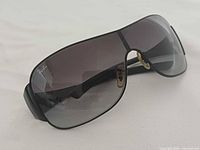 Three-quarter view of Ray-Ban RB3321 sunglasses showing frame and lens