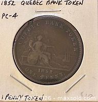 Obverse side of 1852 penny token in holder