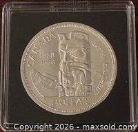 Reverse of 1958 British Columbia Centennial dollar in holder
