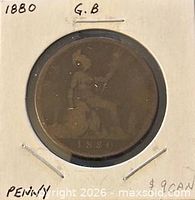 Full view of coin in holder with handwritten annotations