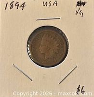 Obverse side of 1894 Indian Head cent in holder showing date and design