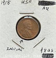 Obverse of 1918 Lincoln cent in cardboard 2x2 holder with handwritten details