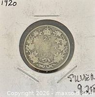 Reverse of 1920 Canadian 25-cent silver coin in holder