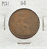 Full view of coin in holder with year and catalog notation