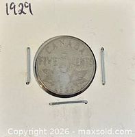 Reverse of 1929 Canadian 5-cent coin in holder