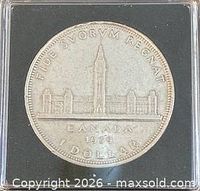 Reverse of 1939 Canadian silver dollar showing Parliament Buildings design