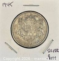 Reverse showing Canadian coat of arms, date, denomination