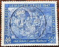 Front view of blue 1947 Leipziger Messe 60+40 pf stamp with cancellation mark