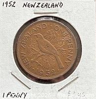 Reverse of 1952 New Zealand one penny coin in holder