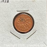 Coin in cardboard holder showing reverse maple leaf design and date