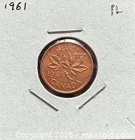 Reverse of 1961 Canadian cent showing maple leaves and date