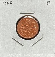 Reverse of 1962 Canada one-cent coin showing maple leaves, date and denomination, inside 2x2 holder