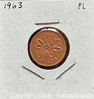 Full view of coin reverse in holder showing date and maple leaves