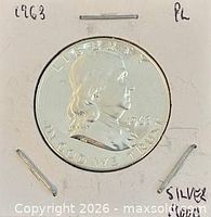 Obverse of coin in 2×2 holder showing date and PL notation