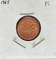 Reverse showing 1965 maple leaf design inside 2x2 holder