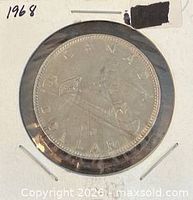 Reverse side showing Voyageur canoe design and 1968 date