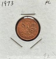 Front of coin in holder showing reverse date and denomination